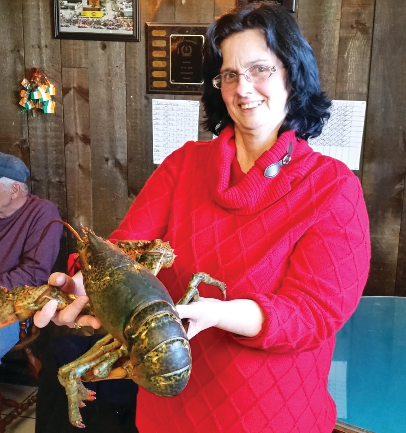 RAFFLE PRIZE: Pam Tameo, West Bay Anglers, with one of the Lobster Raffle prizes.  The Warwick based fishing club raised over $21,000 this year.